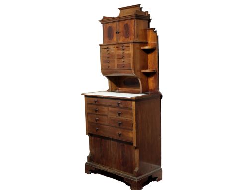 A superb late Victorian inlaid mahogany Dentist Cabinet, by C. Ash &amp; Co., (with label) the attractive galleried top above