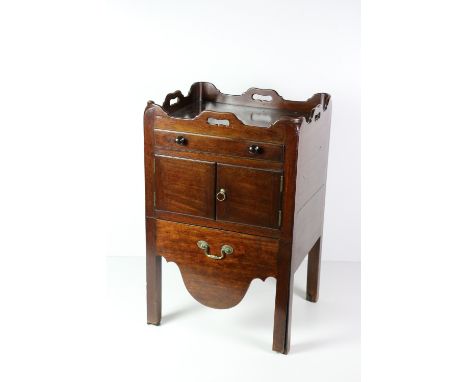 A fine quality Georgian period Irish mahogany Bedside Commode, the tray top over frieze drawer and press with sliding compart