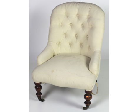 A Victorian Tub Chair, of small proportions, with button upholstered cream fabric, over turned legs with brass castors. (1)