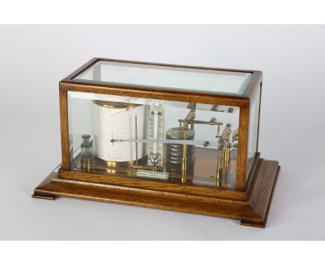 A fine five glass oak cased Barograph, by Pollock and Company Limited Dublin, with brass drum and central thermometer, the li