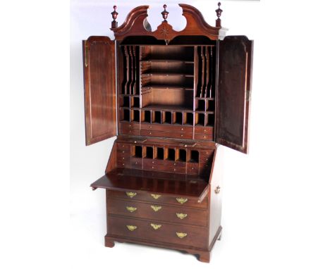 An extremely fine quality 18th Century Irish Georgian period mahogany Bureau Bookcase, the broken swan neck pediment with mou