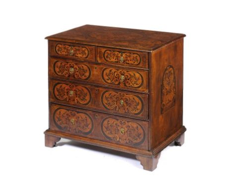 A WILLIAM III WALNUT AND MARQUETRY CHEST OF DRAWERS, C1700   with grotesques and curling foliage to the top, drawers and side