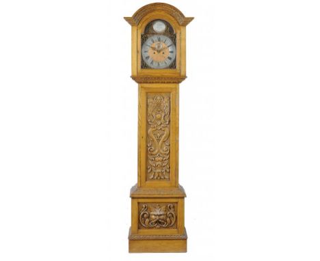 AN EDWARD VII OAK EIGHT DAY LONGCASE CLOCK, C1905  the lacquered brass breakarched dial engraved with the Sun in Splendour an