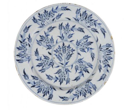 AN ENGLISH DELFTWARE PLATE, PROBABLY LAMBETH (VAUXHALL) MID 18TH C  painted in cobalt with the Mimosa pattern, 30cm diam++Lon