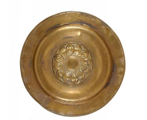 A NUREMBERG BRASS ALMS DISH, 16TH OR 17TH C  with gothic inscription, the raised boss engraved to the centre BChi and on the 
