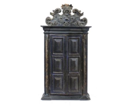 A PORTUGUESE BAROQUE POLYCHROME AND GILT CUPBOARD, 18TH C   with carved cresting and panelled doors enclosing an arched inter
