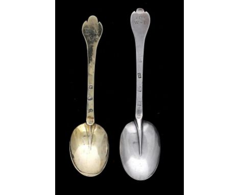 A CHARLES II SILVER GILT TREFID SPOON AND A WILLIAM AND MARY SILVER TREFID SPOON  the first engraved with contemporary initia