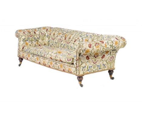 A VICTORIAN CHESTERFIELD SOFA, C1880  in later buttoned upholstery, on turned oak feet with brass castors, 214cm l approx++In