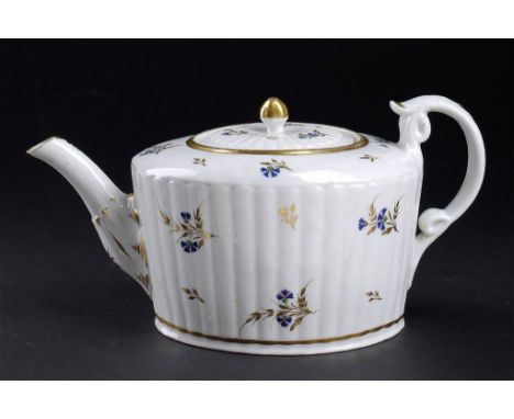 A CAUGHLEY RIBBED OVAL TEAPOT AND COVER, C1795 decorated with the Dresden sprigs pattern, 12cm h++Chip on rim of cover