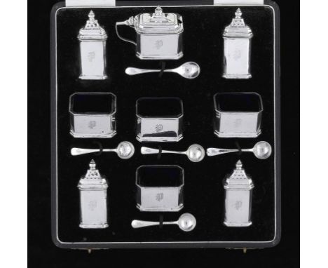 A GEORGE V SILVER NINE PIECE CONDIMENT SET  blue glass liners, pepper casters 7cm h, by Adie Bros Ltd, Birmingham 1930 and 31