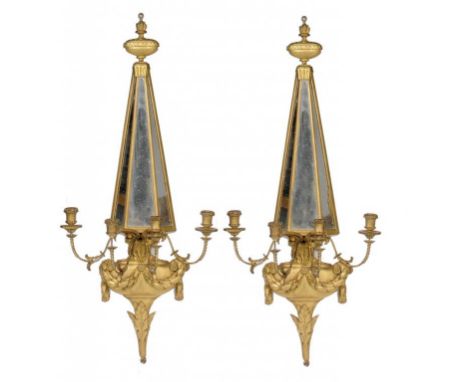 A PAIR OF NEO CLASSICAL STYLE GILTWOOD, COMPOSITION AND MIRROR INSET WALL SCONCES, EARLY 20TH C  with flambeau finial, 112cm 