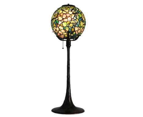 A TIFFANY 'DOGWOOD' BALL LAMP the globular glass shade decorated with a profusion of pale pink and white dogwood blossoms and