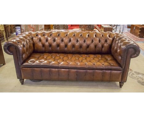 CHESTERFIELD SOFA, Victorian style, hand finished, deep button upholstered in leaf brown leather with rounded back and arms, 