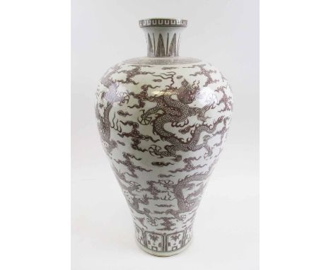 CHINESE CERAMIC VASE, of inverted baluster form, decorated in all-over design of chasing dragons, six character mark to base,