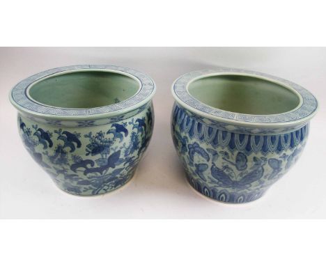 CARP BOWLS, two similar, blue and white Chinese ceramic, variously decorated butterflies and blooms, each 31cm Diam x 23.5cm 