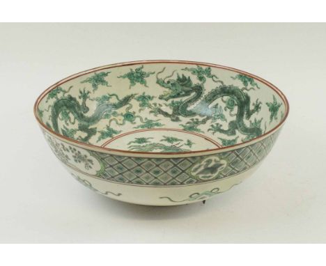 19TH CENTURY CHINESE CERAMIC BOWL, the interior decorated green chasing dragons, 30cm diam x 11.5cm H. (with restoration)