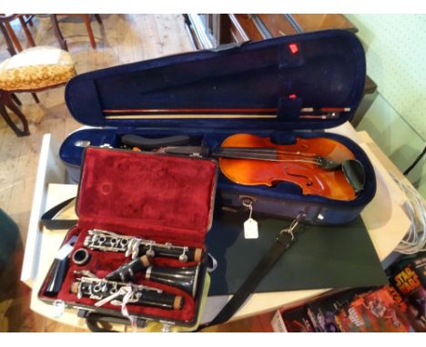 A cased violin and bow, the bridge stamped Bausch, 63cm, together with a cased Jupiter clarinet.
