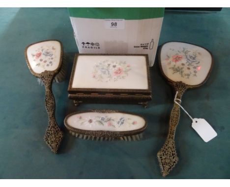 A mid-20th century gilt metal and filigree decoration dressing table set, comprising: two brushes, hand mirror and lidded box