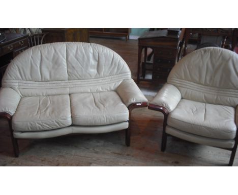 A late 20th century taupe leather two seater sofa with matching single chair.