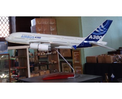 A scale model of an A380 Airbus, 69cm on display stand.