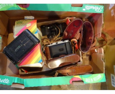 A cased set of Ross stereo prism binoculars no. 98930 in fitted leather case, together with a cased Voightlander camera, a ca