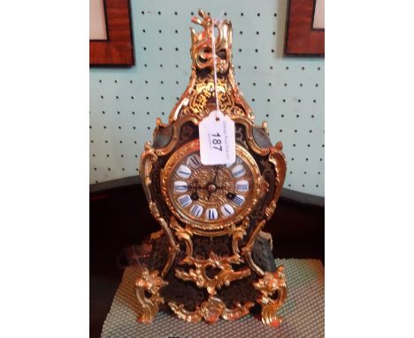 A 19th century French Boulle work mantle clock, having applied ormolu decoration, the eight day striking movement faced by ci