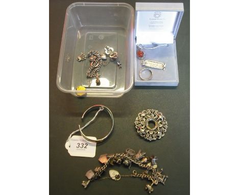 A quantity of silver and white metal jewellery, to include: a bangle, ingot, charm bracelet and other items.