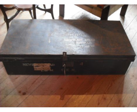 A large tin travelling trunk, early 20th century (110cm wide).