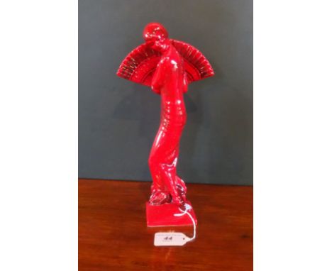 A Peggy Davies Ruby Fusion ceramic figurine, modelled as an Art Deco-style lady holding a fan (28cm).