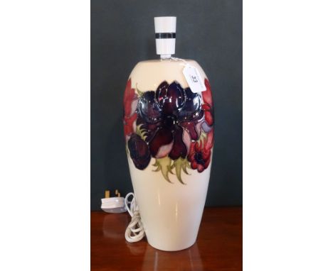 A Walter Moorcroft Anemone pattern tall lamp base, having tubed lined decoration on an ivory ground, impressed marks to base 