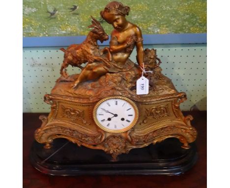 A 19th century gilt mantel clock on strand, the enamel dial signed Henry Mac, Paris, having suited child and goat to top, 46c