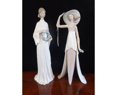 Two Lladro figurines, 6377 'Unity' and 6236 'Lady of Monaco'.