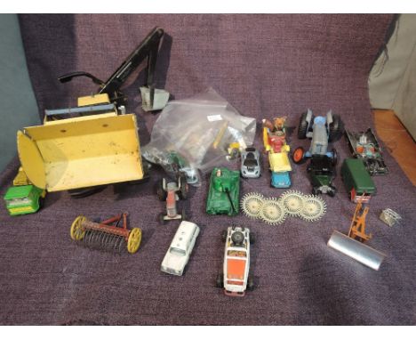 A selection of playworn diecasts including Corgi, Britains and similar along with Britains lead accessories including Petrol 