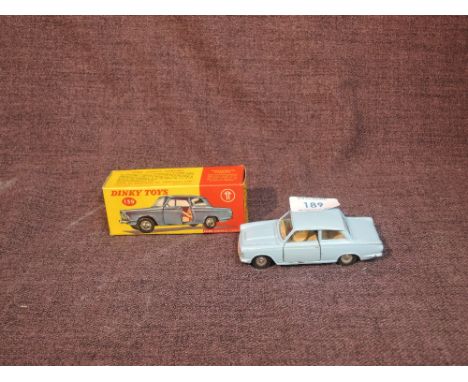 A Dinky diecast, 139 Ford Consul Cortina in light blue with cream interior, opening side doors and tipping seat backs, in ori