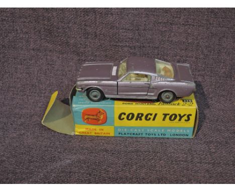 A Corgi diecast, 320 Ford Mustang Fastback 2+2 in metallic lilac with white interior, in original box