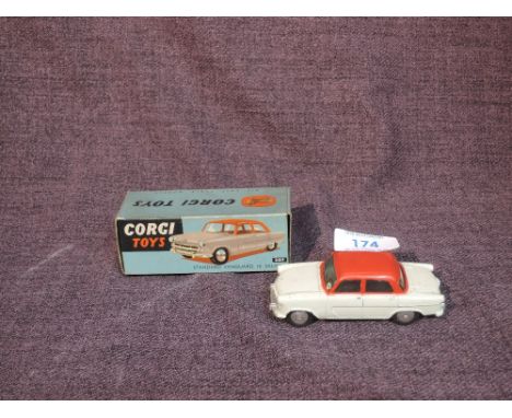 A Corgi diecast, 207 Standard Vanguard III Saloon in pale green with red roof and pillars, in original box