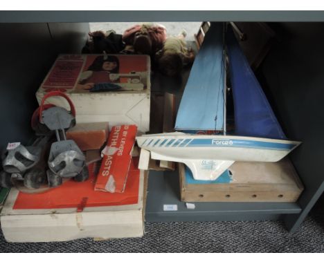 A shelf of vintage Toys and Games including Chad Valley tin plate Soccer, boxed, Singer Little Golden Panoramic Sewing Machin