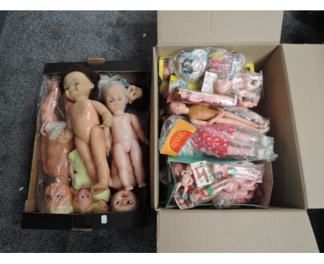 Two boxes of mid 20th century and later celluloid and similar plastic dolls including Empire, Mattel and simiar