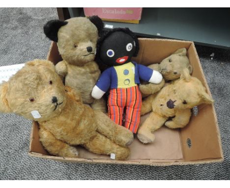 Four mid 20th century straw filled yellow plush Teddy Bears all having plastic eyes, stitched noses &amp; mouths and jointed 
