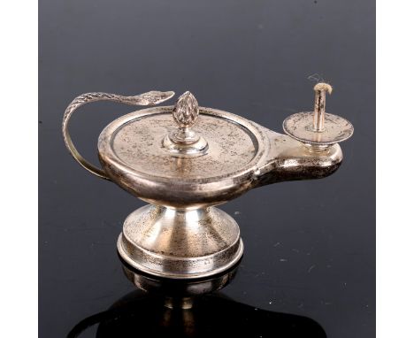 A George V silver Aladdin oil lamp table lighter, by Joseph Braham, indistinct hallmark, height 7cm, length 11cmNo damage, on