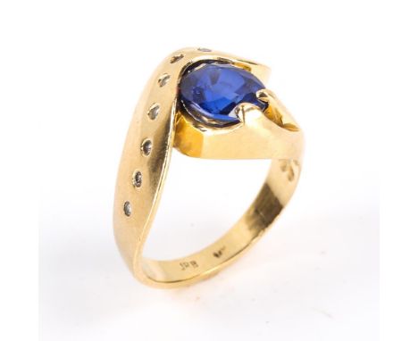 A modern Continental 14ct gold synthetic sapphire and diamond crossover ring, heavy wraparound settings with oval mixed cut s