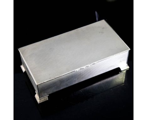 A George VI silver cigarette box, rectangular form with allover engine turned decoration, by John Rose, hallmarks Birmingham 