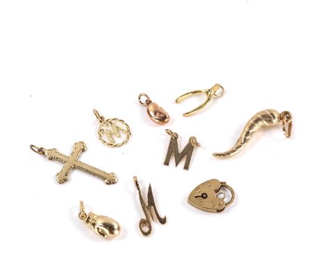 Various 9ct gold charms and pendants, including wishbone, magic bean, boxing glove etc, 9.7g totalLot sold as seen unless spe