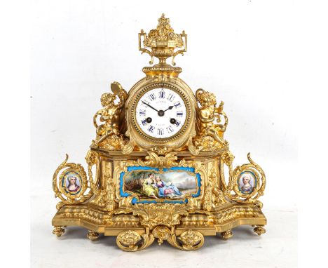 A 19th century French ormolu 8-day mantel clock, by Hatton of Paris, white enamel dial with blue Roman numeral hour markers, 