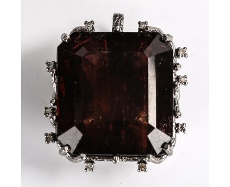 A large 130.97ct brownish pink tourmaline and diamond pendant, unmarked oxidised silver organic design settings with rectangu