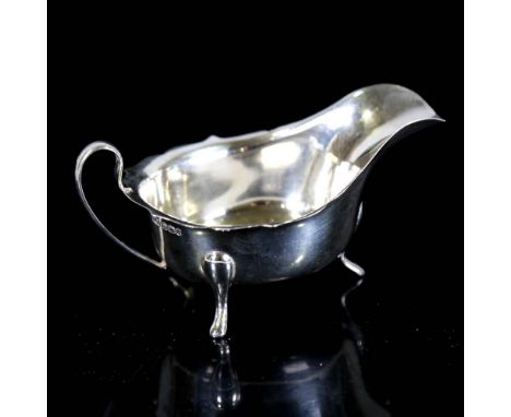 A George VI silver sauce boat, with scalloped rim, by Viner's Ltd, hallmarks Sheffield 1940, length 14.5cm, 3.5ozNo damage or
