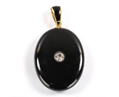 A Victorian onyx paste and black enamel mourning pendant locket, unmarked yellow metal settings, pendant height excluding bal