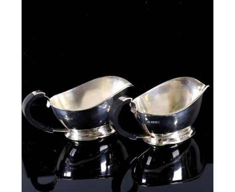 A pair of George VI Art Deco silver sauce boats, stylised form with ebonised handles, by S Blanckensee & Sons Ltd, hallmarks 