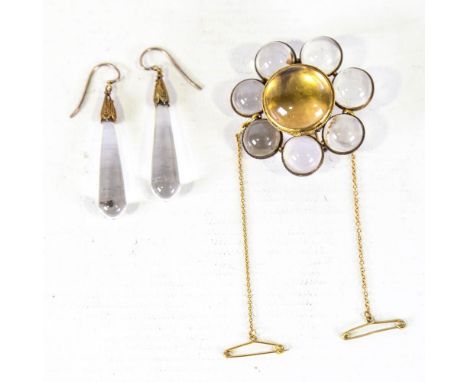 A Victorian rock crystal 'Pools of Light' demi-parure, comprising flowerhead brooch and pair of pendant earrings, unmarked ye