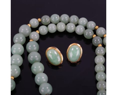 A Chinese single-row polished jade bead necklace, and a similar pair of jade stud earrings, necklace length 70cm, 84.3g total